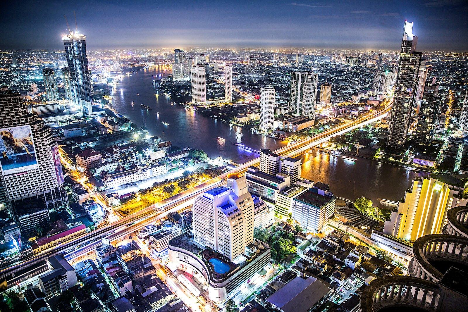 Bangkok at night from above, along the Chao Phraya river